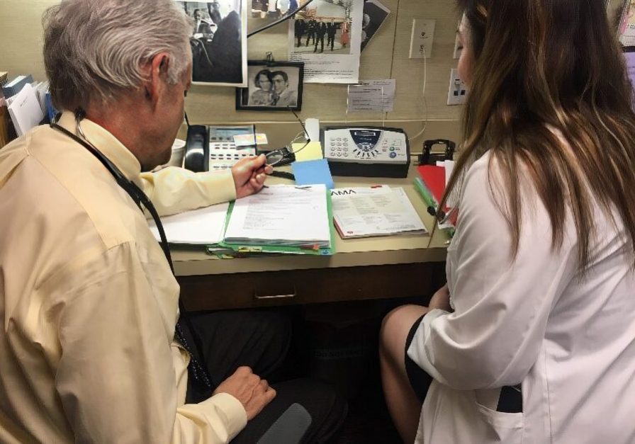 Office meeting between two healthcare workers