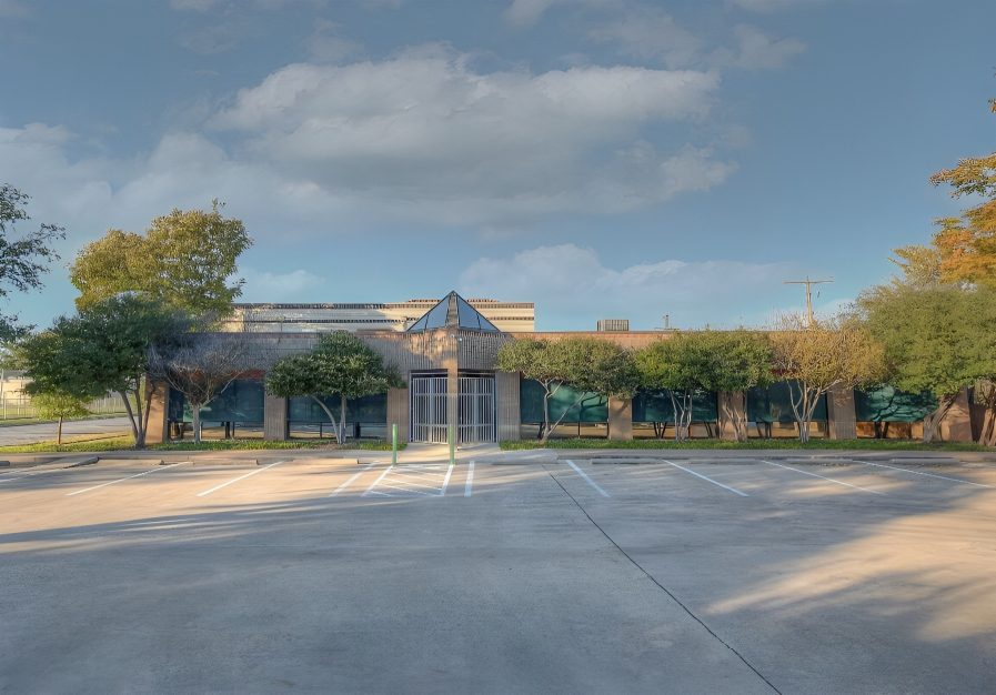 Empty parking lot in front of building