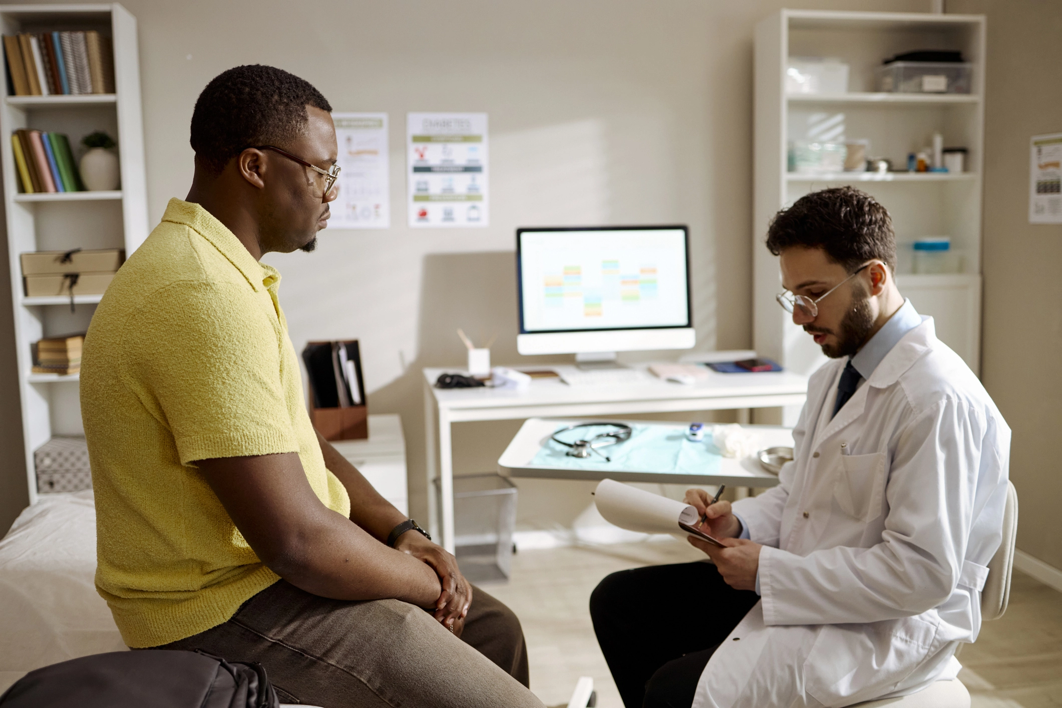 Healthcare provider noting patient's information